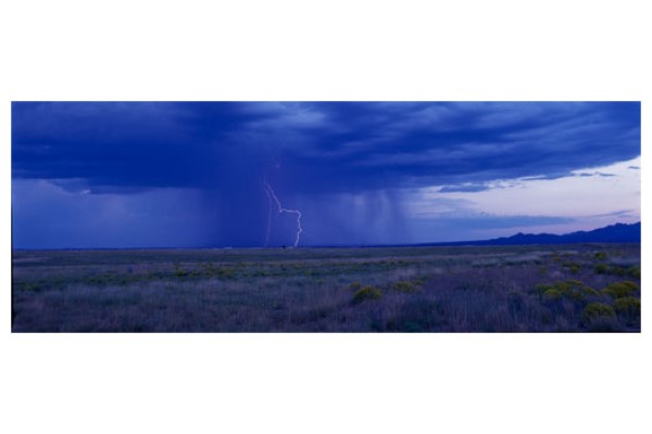 Monsoon Rain Pouring on to Flat Plains with a Lightning Strike