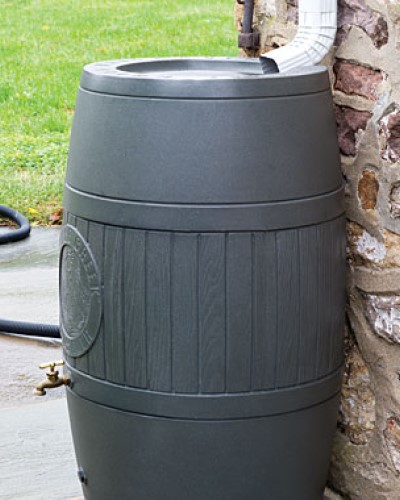 RainSaver Barrel by Poly-Mart Catching Rain from a Gutter Spout